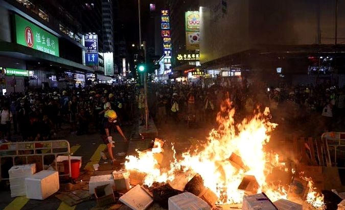 Radical protesters set fire at the intersection of Nathan Road and Shantung Street in Mong Kok, Hong Kong, Sept 6, 2019.