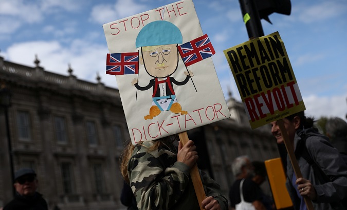 An anti-Brexit protestor holds a sign during a 