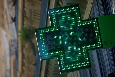A pharmacy sign displays a temperature of 37 degrees Celsius in Marseille (South of France) in June.