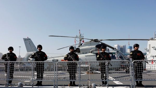 Chinese People's Liberation Army (PLA) Navy soldiers stand guard on the guided missile destroyer Xining as they depart for the escort mission in the Gulf of Aden and off the Somali coast, at a port in Qingdao, Shandong province, China August 29, 2019.