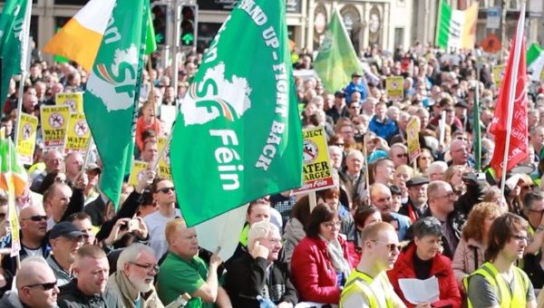 Sinn Fein members protest.