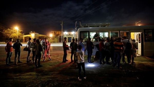 Migrants waiting at a police checkpoint in Cucuyagua, Honduras, January 20, 2019.