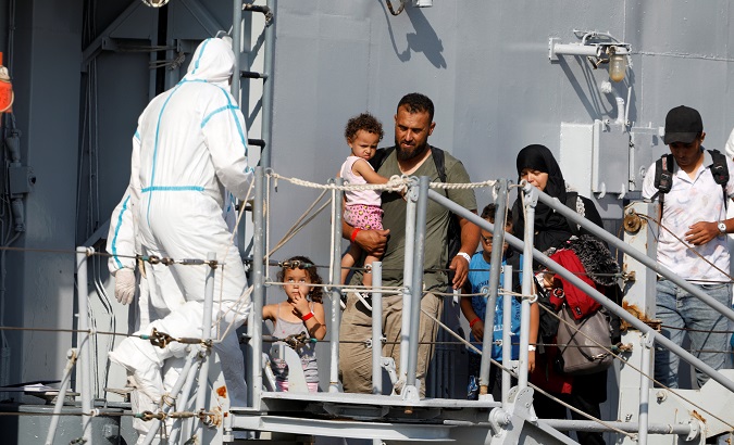 The Italian navy's vessel Cassiopea arrives with migrants on board at Pozzallo, Italy Sept. 2, 2019.