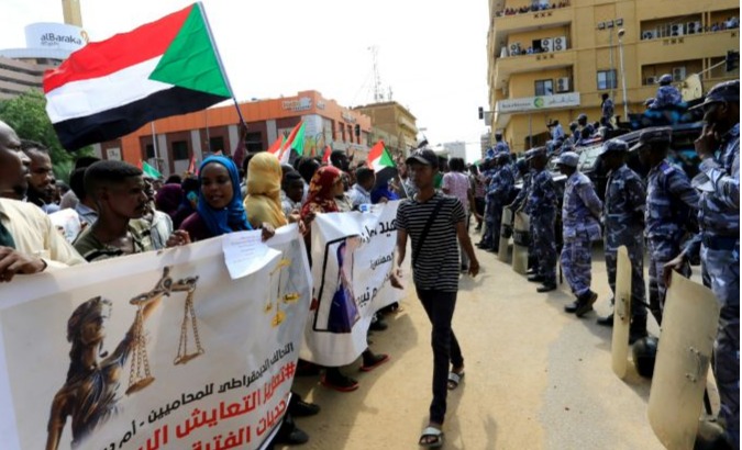Sudanese demonstrators attend a protest calling for the appointment of top judicial officials and justice for killed demonstrators, outside the presidential palace in Khartoum, Sudan, September 12, 2019.