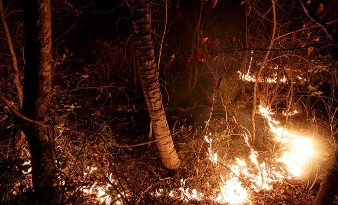 Fire burns at the Guarani Nation Ecological Conservation Area Nembi Guasu, where wildfires have destroyed hectares of forest, in the Charagua region, Bolivia, Aug. 29, 2019.