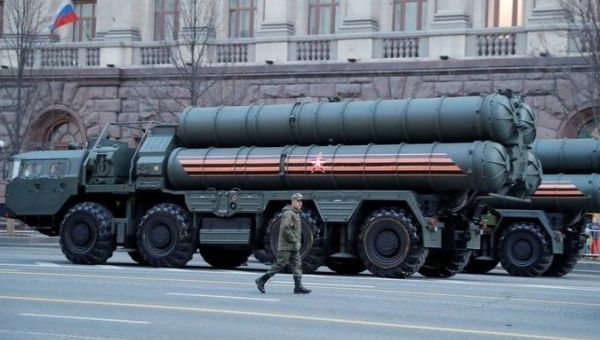 A Russian serviceman walks past S-400 missile air defence systems in Tverskaya Street before a rehearsal for the Victory Day parade.