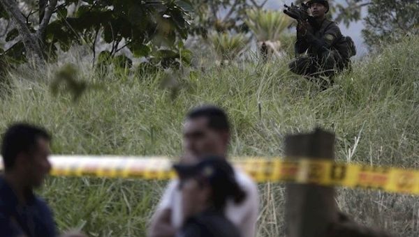 Prosecutor's Office members perform forensic work at site where candidate Karina Garcia was murdered, in Cauca department, Colombia, Sep. 8, 2019.
