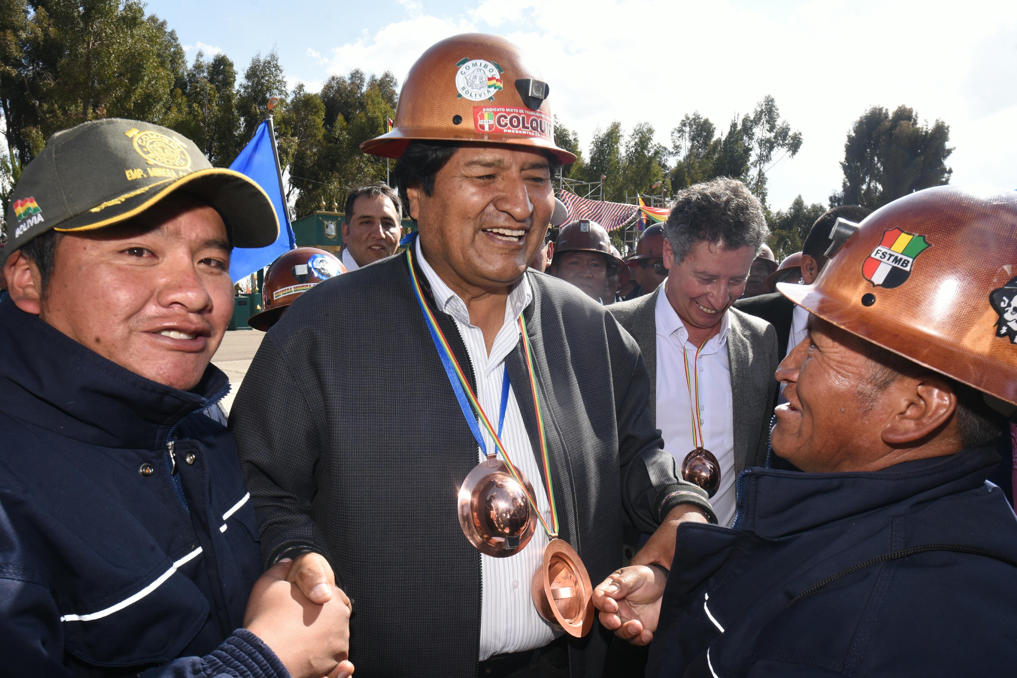 Evo Morales greets supporters from the mine workers union on Monday.