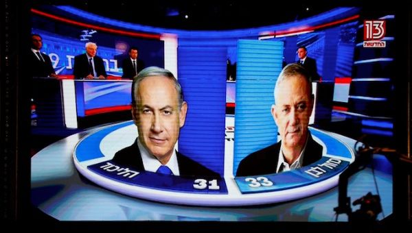 The results of the exit polls are shown on a screen at Benny Gantz's Blue and White party headquarters, following Israel's parliamentary election, in Tel Aviv, Israel, September 17, 2019.