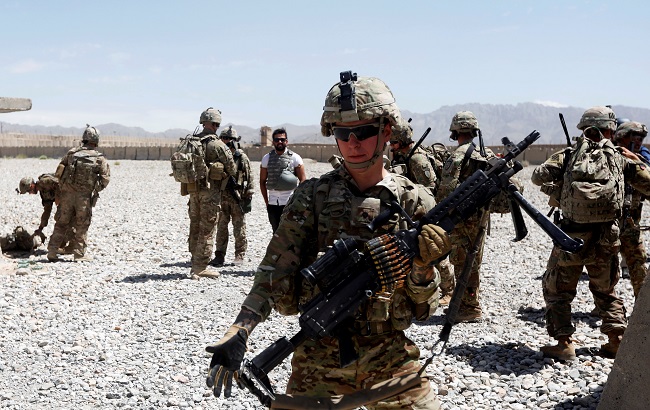 U.S. troops wait for their helicopter flight at an Afghan National Army (ANA) Base in Logar province, Afghanistan August 7, 2018.