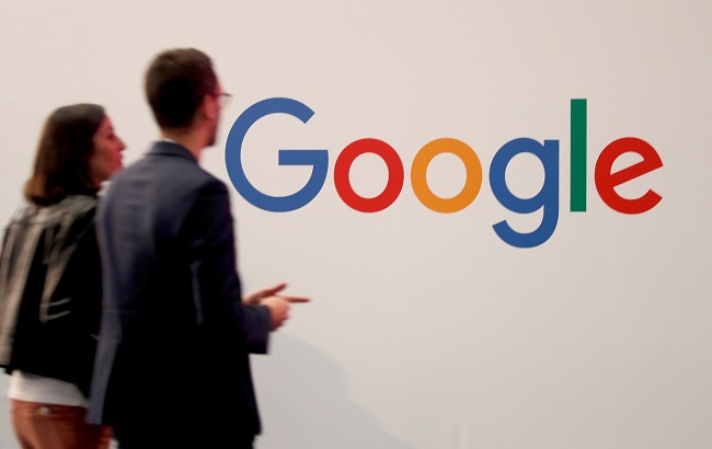 Visitors pass by the logo of Google at the high profile startups and high tech leaders gathering, Viva Tech,in Paris, France May 16, 2019.