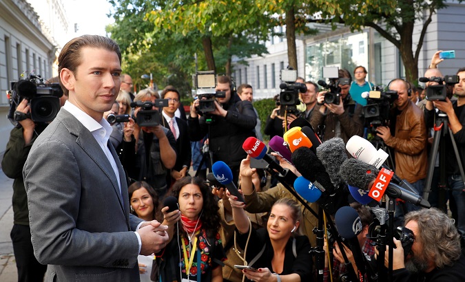Top candidate of Peoples Party (OeVP) and former Chancellor Sebastian Kurz talks with journalists after casting his ballot at a polling station in Vienna, Austria Sept. 29, 2019.