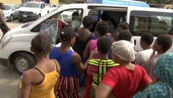 A still image taken from a video shows women, who were freed by police with other girls and women that were held captive, entering a bus in Lagos, Nigeria, September 30, 2019.