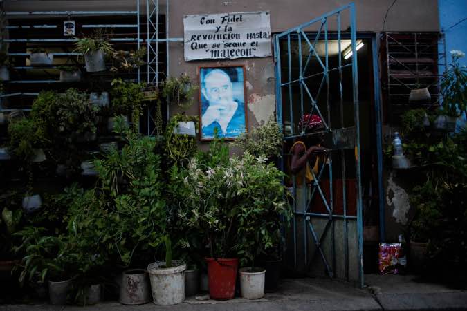 An image of late Cuban President Fidel Castro is displayed at the entrance of a house in Havana, Cuba, September 30, 2019