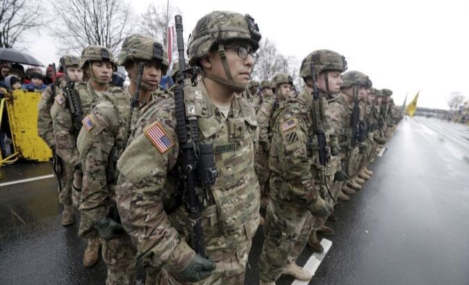 U.S. troops participate in Latvia's Independence Day military parade in Riga, Latvia, November 18, 2015.