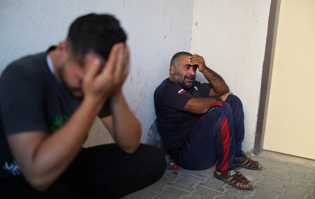 Relatives of a Palestinian who was killed at the Israeli-Gaza border fence, react at the hospital in the northern Gaza Strip October 4, 2019.