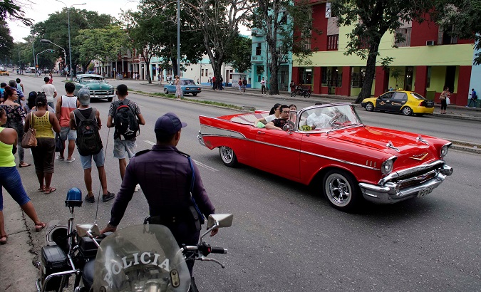 A vintage car with tourists in Havana, Cuba, Oct. 2, 2019.