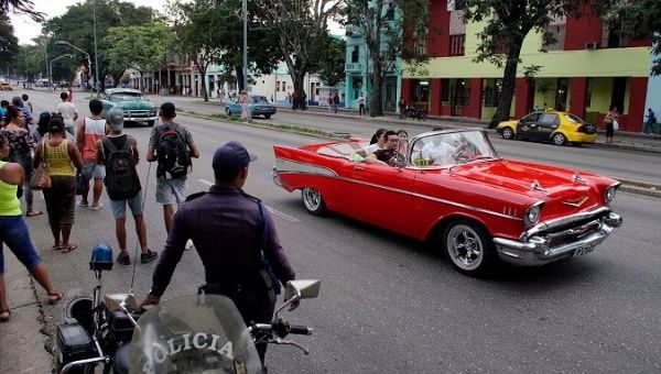 A vintage car with tourists in Havana, Cuba, Oct. 2, 2019. 