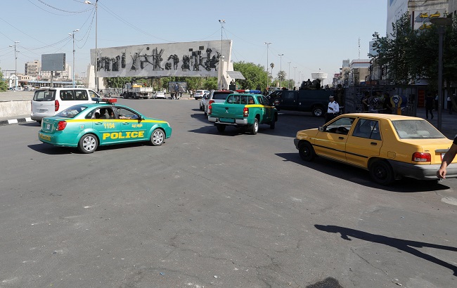 Police and Iraqi security forces vehicles are seen at Tahrir square after lifting of he curfew, following four days of nationwide anti-government protests turned violent, in Baghdad Iraq October 5, 2019.