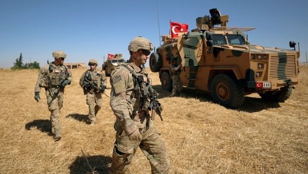 U.S. soldiers walk together during a joint U.S.-Turkey patrol, near Tel Abyad, Syria September 8, 2019. 