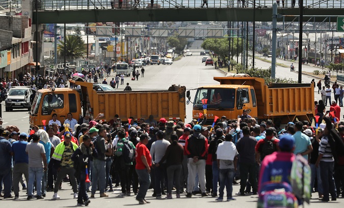 Trucks block main roads during protests after Ecuador's President Lenin Moreno's government ended four-decade-old fuel subsidies, in Carapungo, near Quito, Ecuador, Oct. 7, 2019.