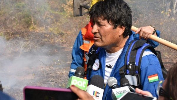 Evo Morales speaking to media after having helped frontline staff combat the fires in the Chiquitania.