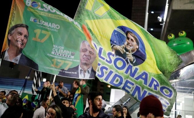 Supporters of Jair Bolsonaro, far-right lawmaker and presidential candidate of the Social Liberal Party (PSL), react after Bolsonaro wins the presidential race, in Sao Paulo, Brazil October 28, 2018.