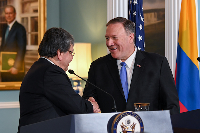 U.S. Secretary of State Mike Pompeo and Colombia’s Foreign Minister Carlos Holmes Trujillo shake hands as they deliver statements at the State Department in Washington, U.S., October 9, 2019.