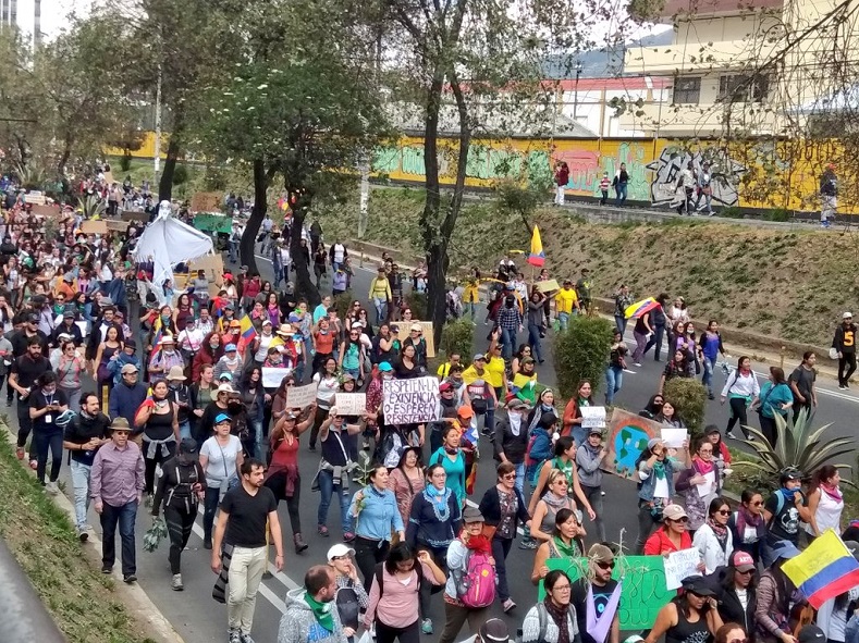 Women shouting 'No more deaths' as they march towards downtonwn Quito, Ecuador, October 12, 2019.