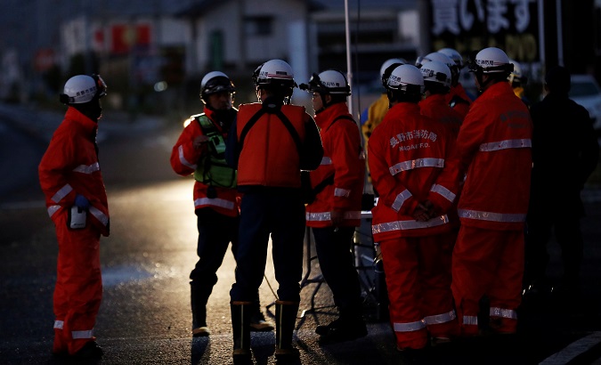 Rescue workers are seen in the flooded area after Typhoon Hagibis in Nagano, Nagano Prefecture, Japan, October 13, 2019.