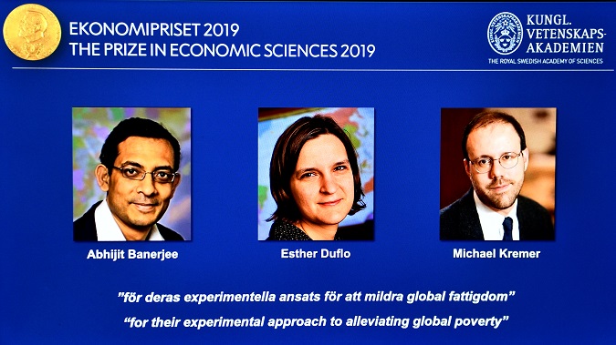 The portraits of Abhijit Banerjee, Esther Duflo, and Michael Kreme, who have been announced the Nobel Prize in Economic Sciences 2019 winners, are seen at a news conference at the Royal Swedish Academy of Sciences in Stockholm.