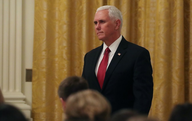 U.S. Vice President Mike Pence watches as President Donald Trump holds a joint news conference with Italy's President Sergio Mattarella in the East Room of the White House in Washington, U.S., October 16, 2019.