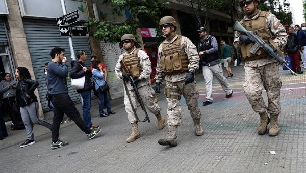 Soldiers patrol streets after a protest against the increase in subway ticket prices in Santiago, Chile, October 19, 2019.