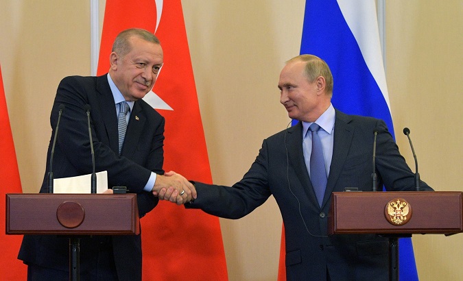 Russian President Vladimir Putin shakes hands with Turkish President Tayyip Erdogan during a news conference following their talks in Sochi, Russia Oct. 22, 2019.