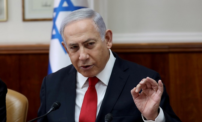 Israeli Prime Minister Benjamin Netanyahu gestures while speaking during the weekly cabinet meeting in Jerusalem.