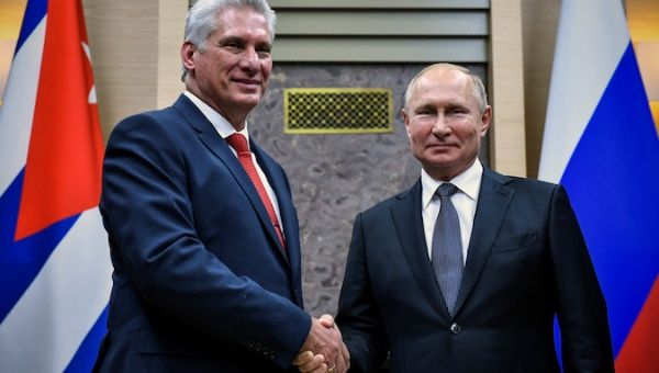 Russian President Vladimir Putin shakes hands with his Cuban counterpart Miguel Diaz-Canel at the Novo-Ogaryovo state residence outside Moscow, Russia October 29, 2019.