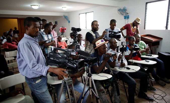 Journalists attend a news conference by opposition politicians in Port-au-Prince, Haiti Oct. 23, 2019.