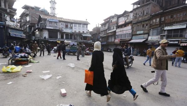 Kashmiri residents run at the site of a grenade blast in Srinagar, November 4, 2019. 