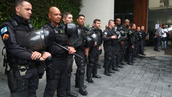 Police officers guard outside the venue where Brazil's government's auction for offshore oil fields is held, in Rio de Janeiro, Brazil, Nov. 6, 2019.