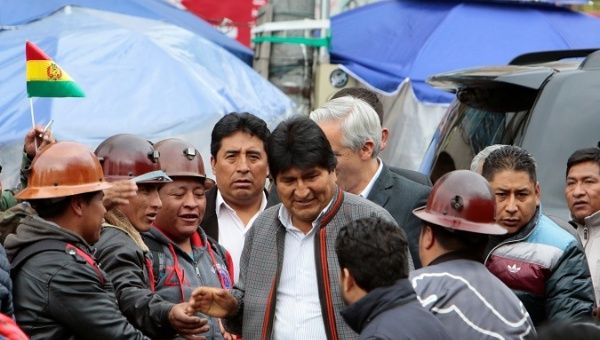 President Evo Morales talks with mine workers after a rally in La Paz, Bolivia, Nov. 5, 2019.