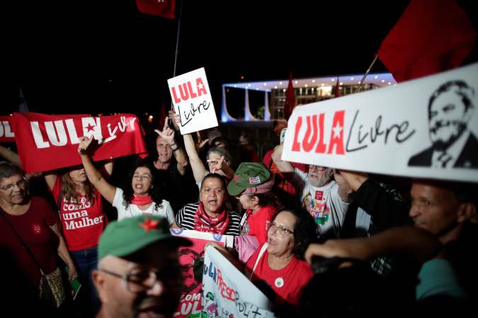 Supporters of Brazil's former president Luiz Inacio Lula da Silva protest outside the Supreme Federal Court in Brasilia