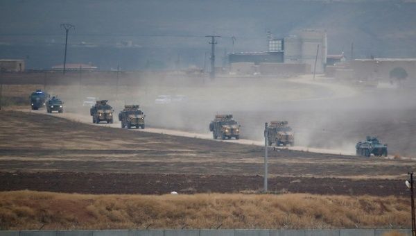 Turkish and Russian military vehicles return following a joint patrol in northeast Syria, as they are pictured from near the Turkish border town of Kiziltepe in Mardin province, Turkey, November 1, 2019. 