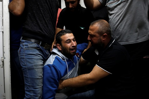 Palestinian mourns after his relative was killed in Gaza.