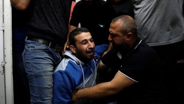Palestinian mourns after his relative was killed in Gaza.