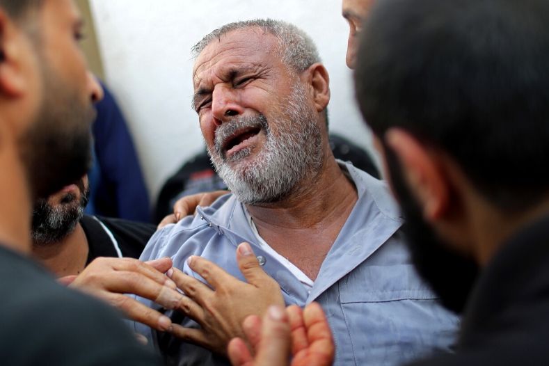 A Palestinian man reacts in Shifa hospital after learning his relative was killed in Gaza November 13, 2019.