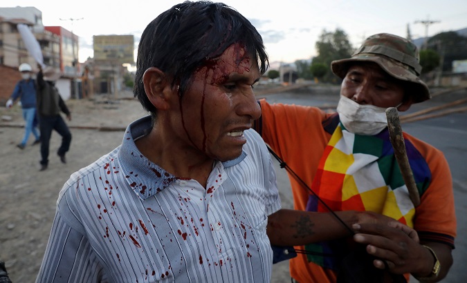 A supporter of Evo Morales is injured by the Jeanine Añez administration's security forces in Cochabamba, Bolivia, Nov. 18, 2019.