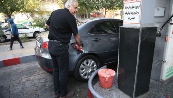 A man fills up his car's tank at a petrol station, after fuel price increased in Tehran, Iran November 15, 2019.