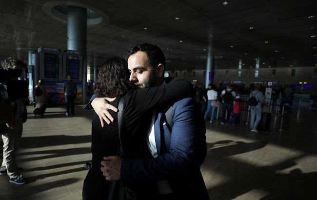 Omar Shakir, a U.S. citizen representing New York-based Human Rights Watch (HRW) in Israel and the Palestinian territories, hugs a friend at the terminal before departing Israel at Ben Gurion International Airport, near Tel Aviv, Israel November 25, 2019.