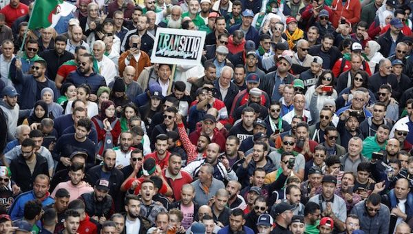 Demonstrators chat slogans during a protest to demand that a presidential election next month be cancelled until the old ruling guard steps aside and the army quit politics, in Algiers, Algeria November 29, 2019. 