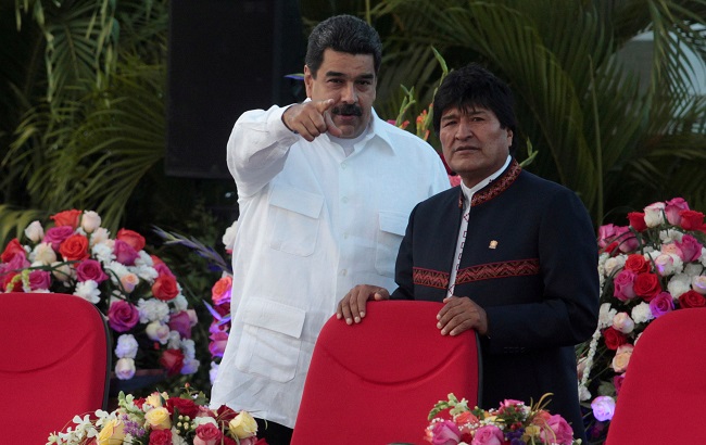 Venezuela's President Nicolas Maduro speaks with Bolivia's President Evo Morales during the swearing-in ceremony for the third term of Nicaragua's President Daniel Ortega at the revolution square in Managua, Nicaragua January 10,2017.
